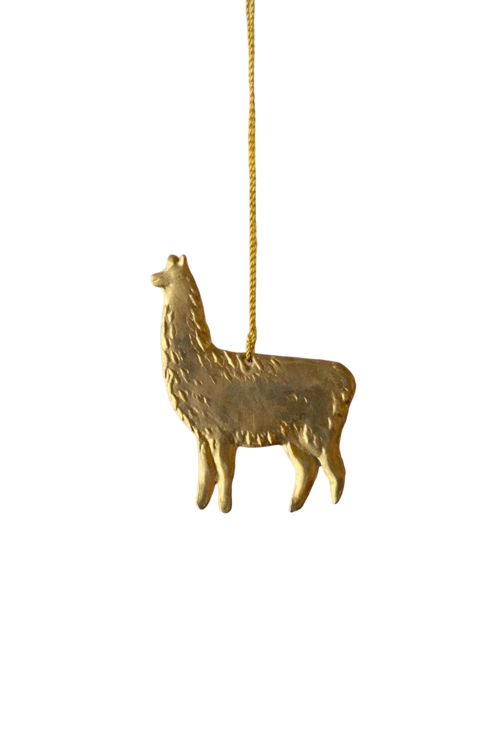 Gold llama-shaped pendant on a pink background with gold stars
